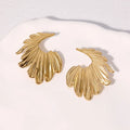 A pair of stainless steel earrings in a leaves shape with a gold electroplated finish.