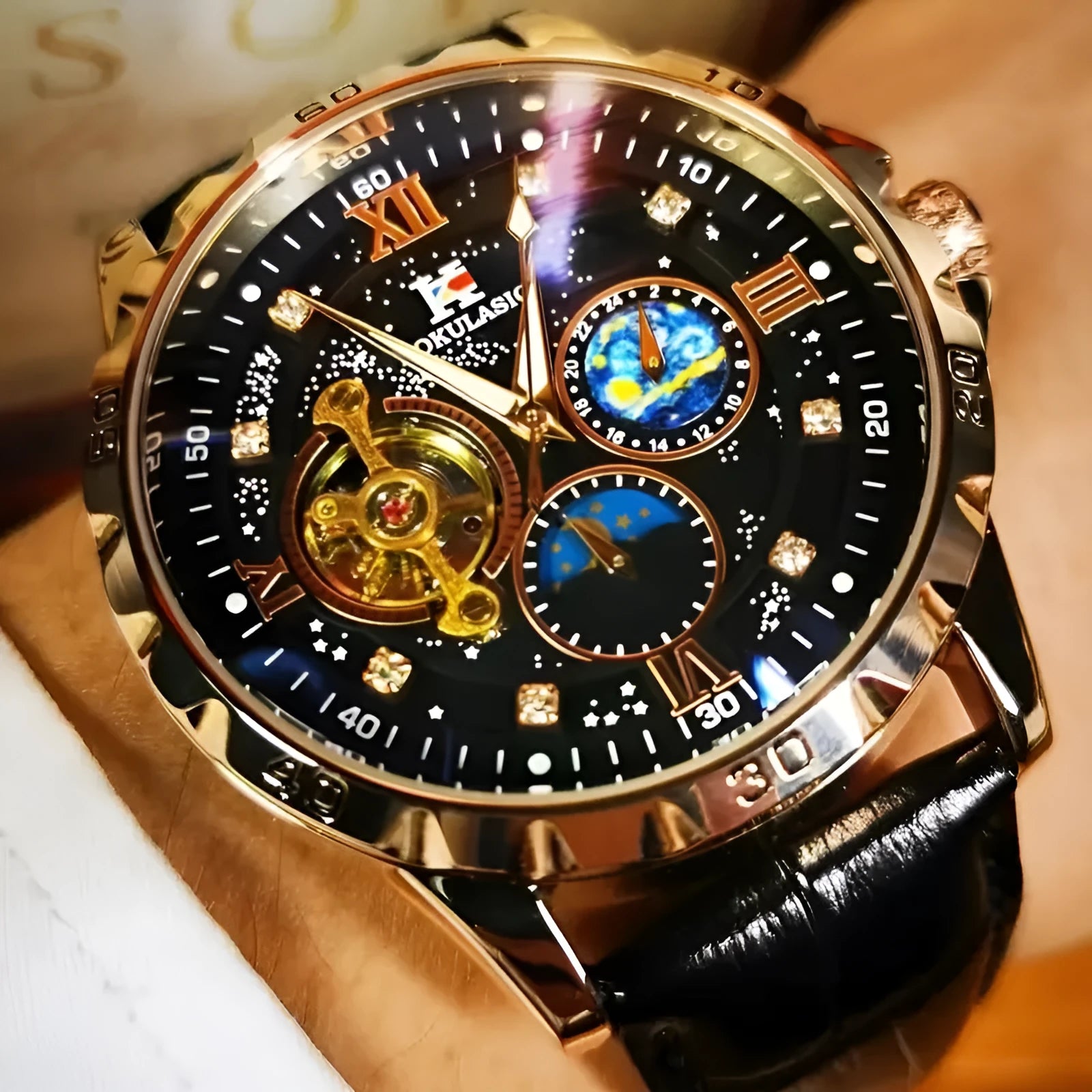 Men's automatic mechanical watch with black hollow dial and rose gold case on a leather strap.