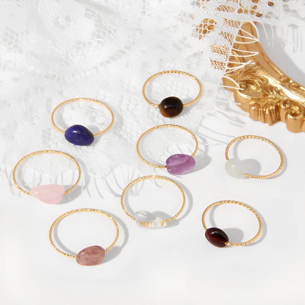 Close-up of a women's geometric agate ring showing its original design and coloured stone.