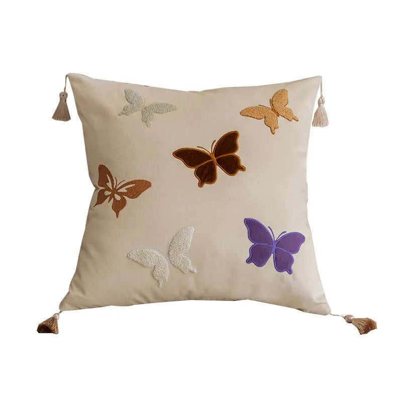 Square beige cushion with detailed Chinese style butterfly embroidery.
