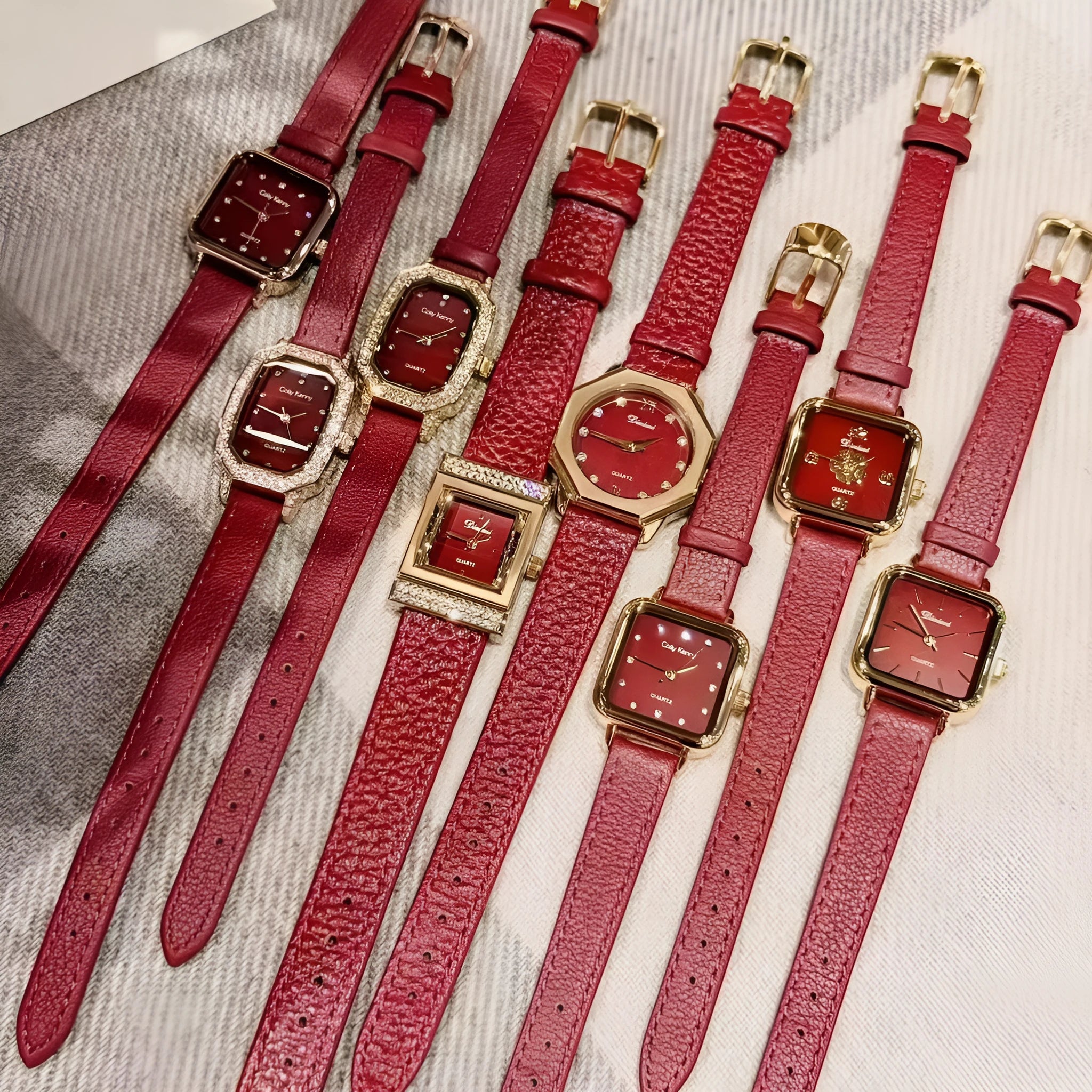Red dial women's alloy watch with Chinese style decorative design on wrist.