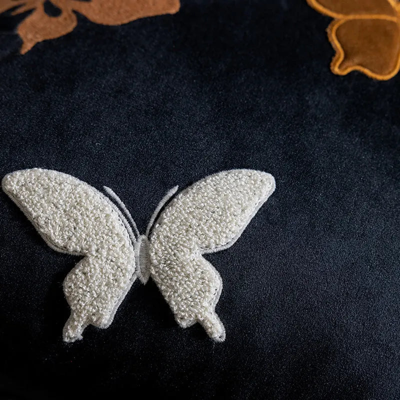Square beige cushion with detailed Chinese style butterfly embroidery.