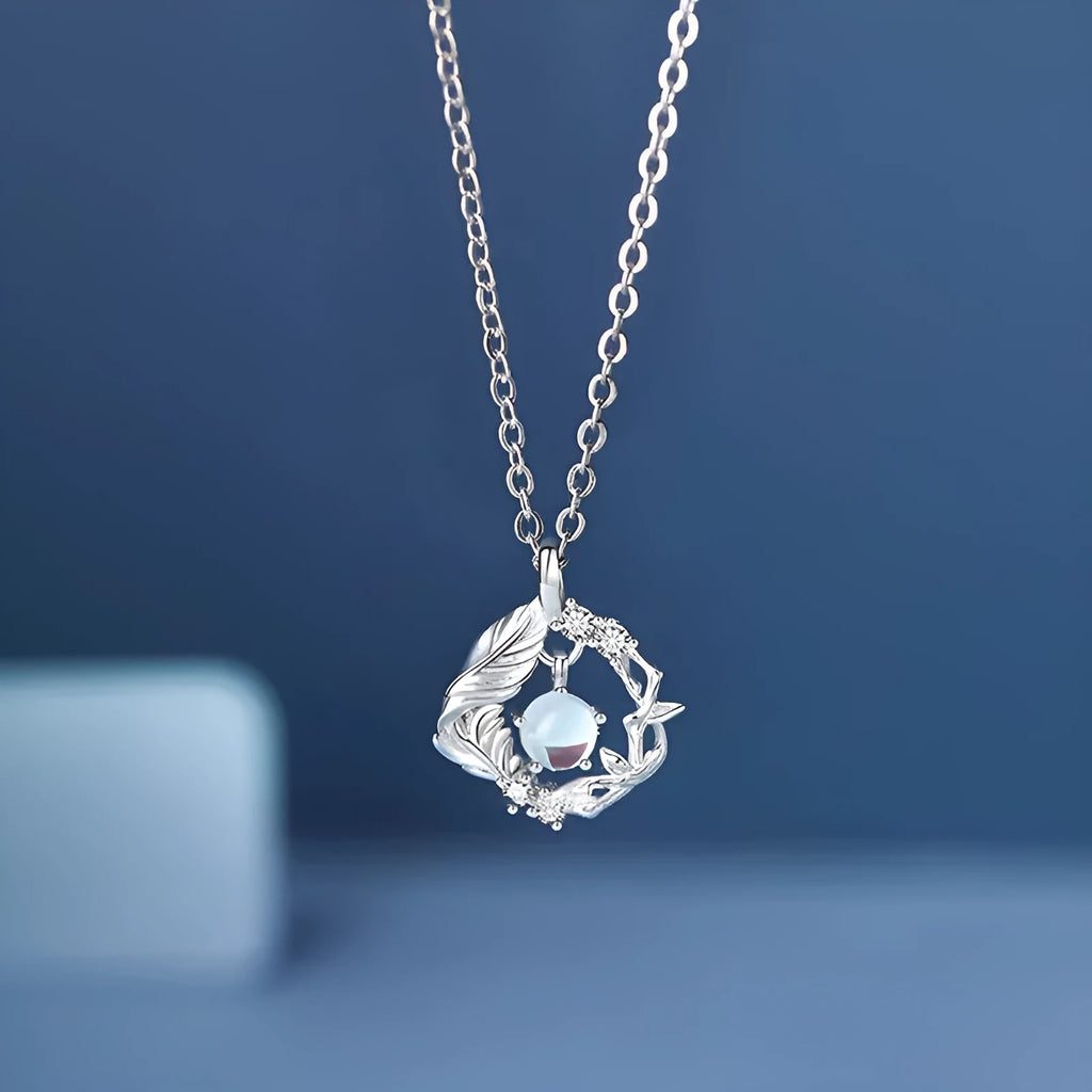 Women's geometric tree and bird pendant necklace with adjustable chain in blue eucalyptus colour
