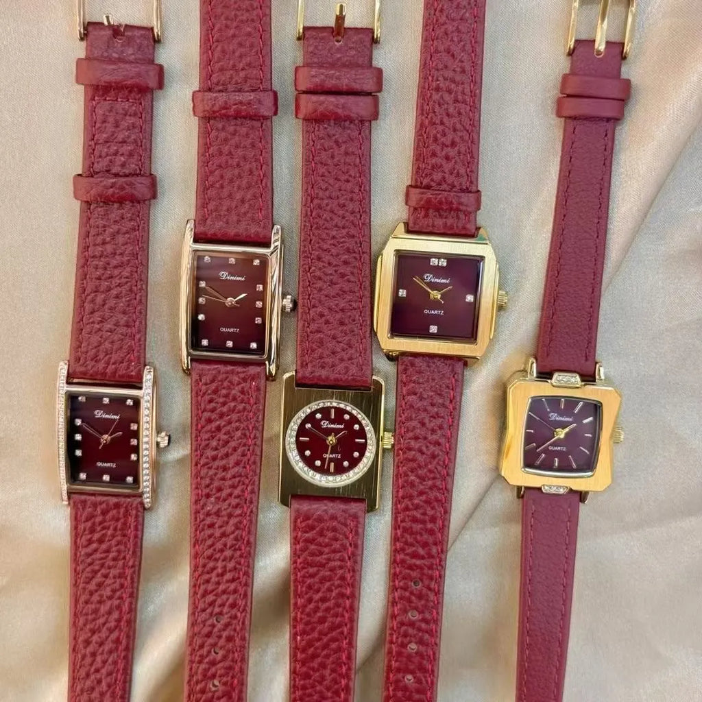 Red dial women's alloy watch with Chinese style decorative design on wrist.