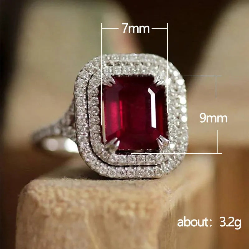 Copper geometric square ring with rhinestones in F827 red, shown on a finger.