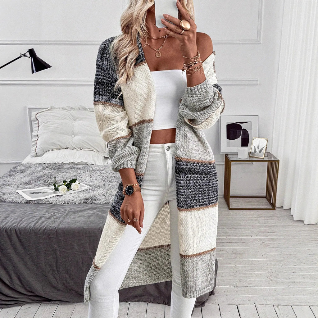 Grey striped knitted women's cardigan with long sleeves and loose fit