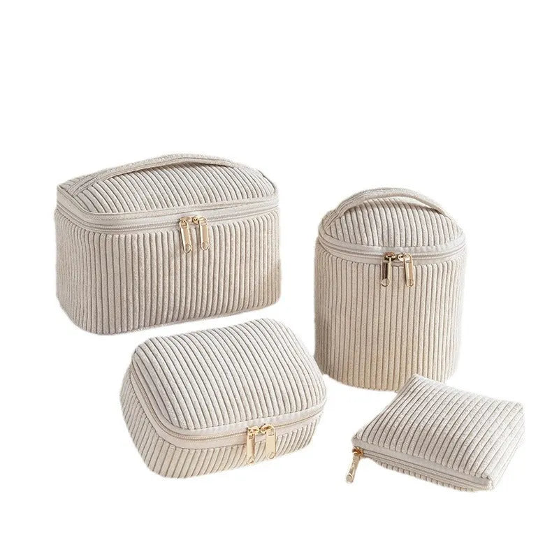 Set of four cube-shaped flannelette makeup bags in a choice of colours including pink dots and blue with dots.