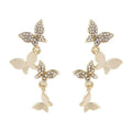 Women's copper earrings with four butterfly designs and gold butterfly-shaped pendant drops