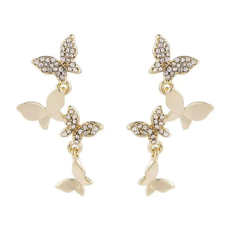 Women's copper earrings with four butterfly designs and gold butterfly-shaped pendant drops