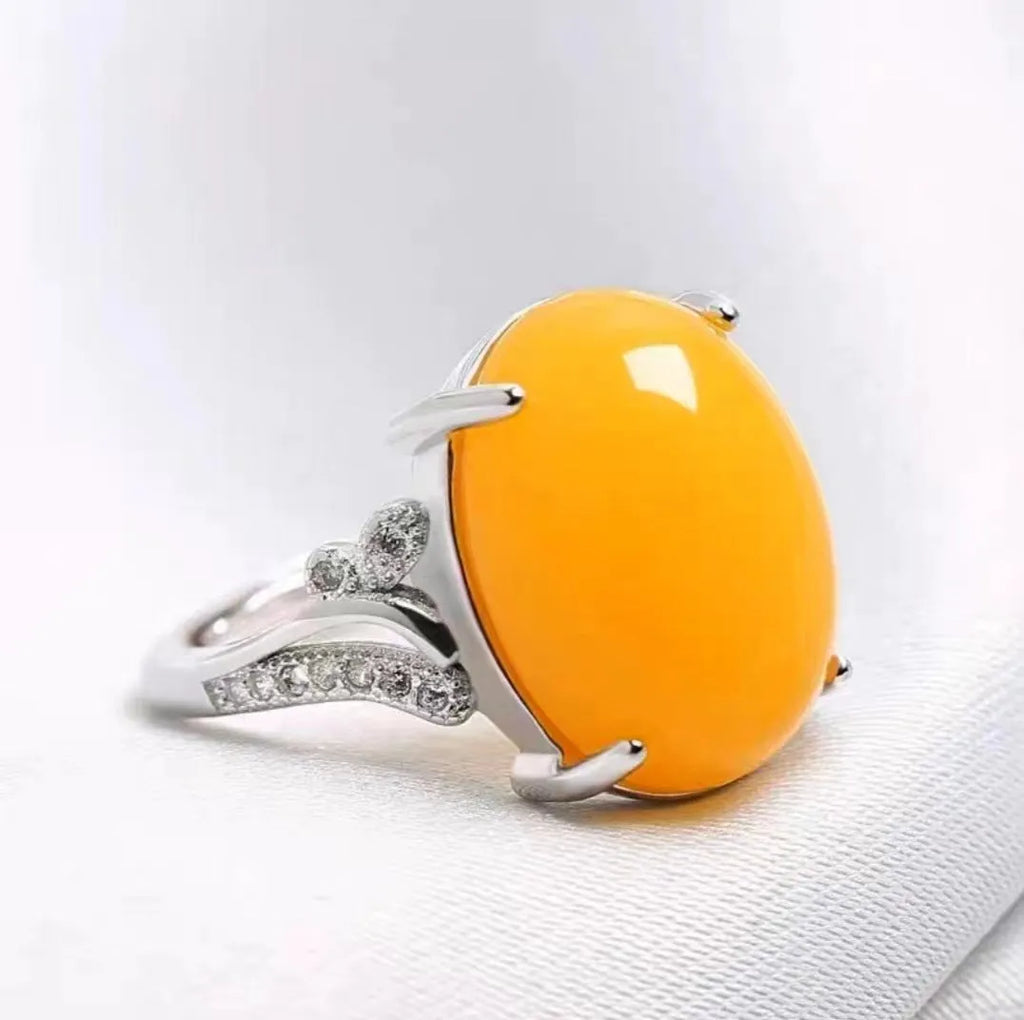 Adjustable geometric ethnic ring with a natural sapphire stone in alloy, shown in multiple colours.