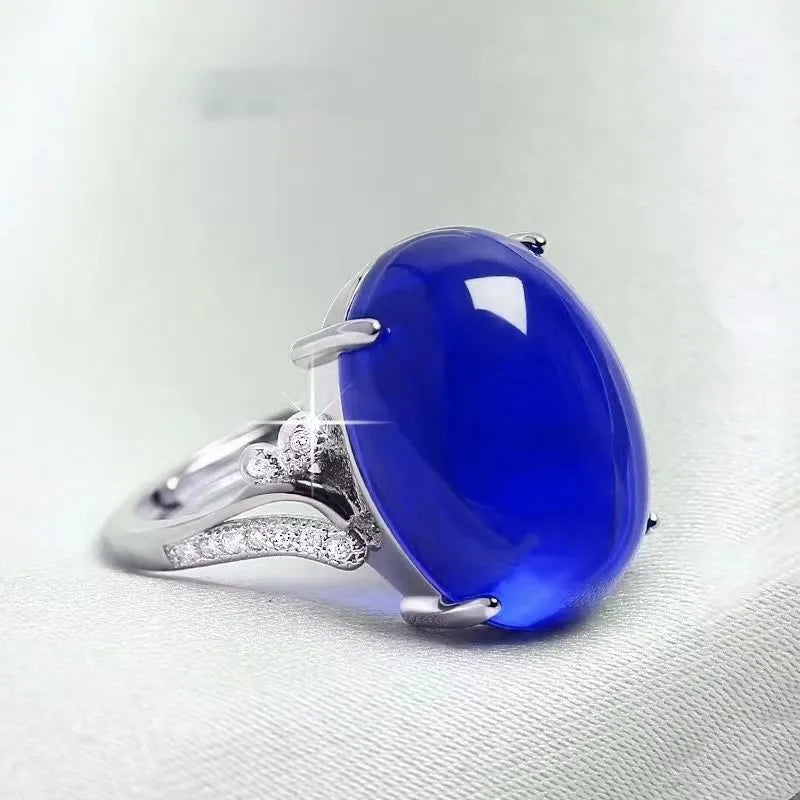 Adjustable geometric ethnic ring with a natural sapphire stone in alloy, shown in multiple colours.