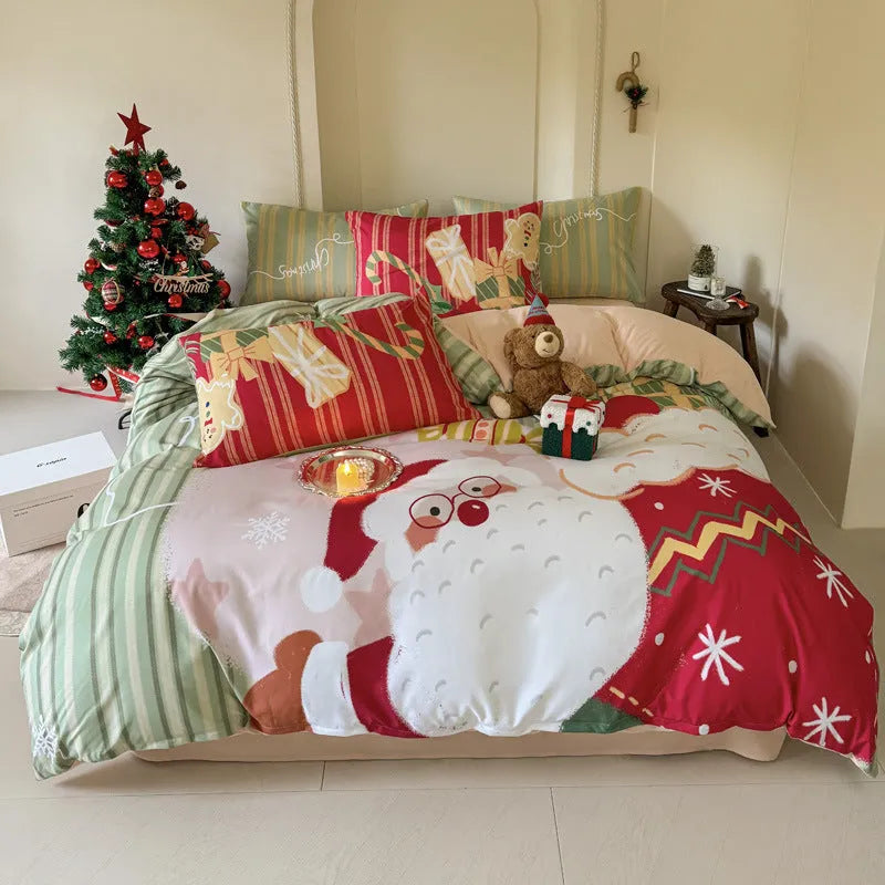Christmas cartoon pattern four-piece bedding set with sheet, quilt cover, and two pillowcases on a bed.