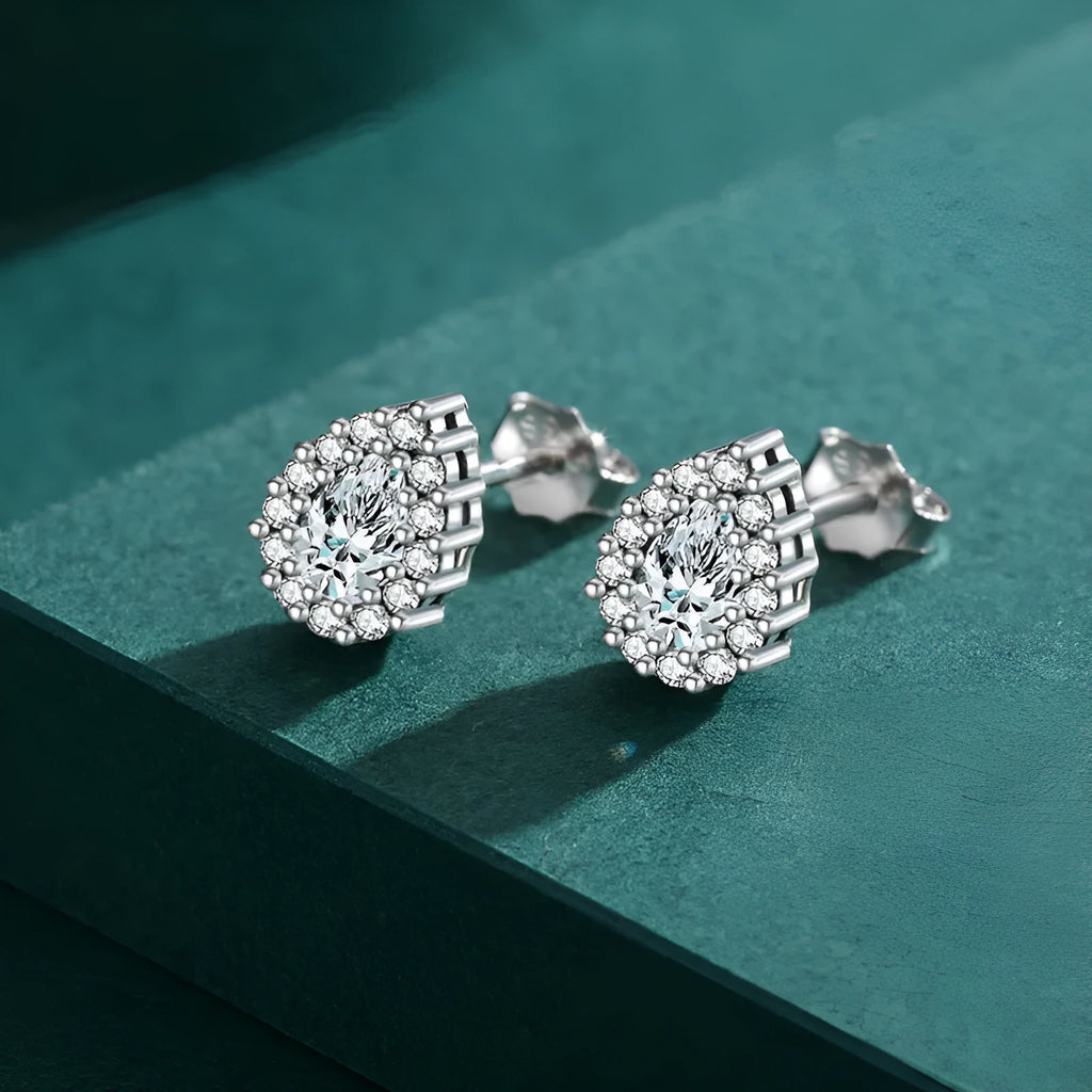 Women's silver drop ear studs in 925 sterling silver with diamond treatment finish