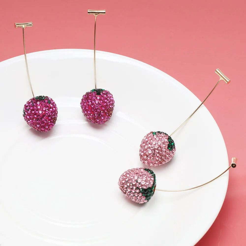 A pair of geometric strawberry-shaped stud earrings with spot drill texture, shown in red zinc alloy.