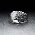 Men's silver geometric wolf-shaped alloy ring on a grey background.