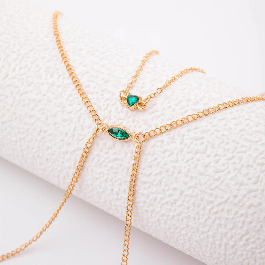 Men's simple gold-toned alloy body chain necklace with electroplated 25729 gold finish on a plain background.