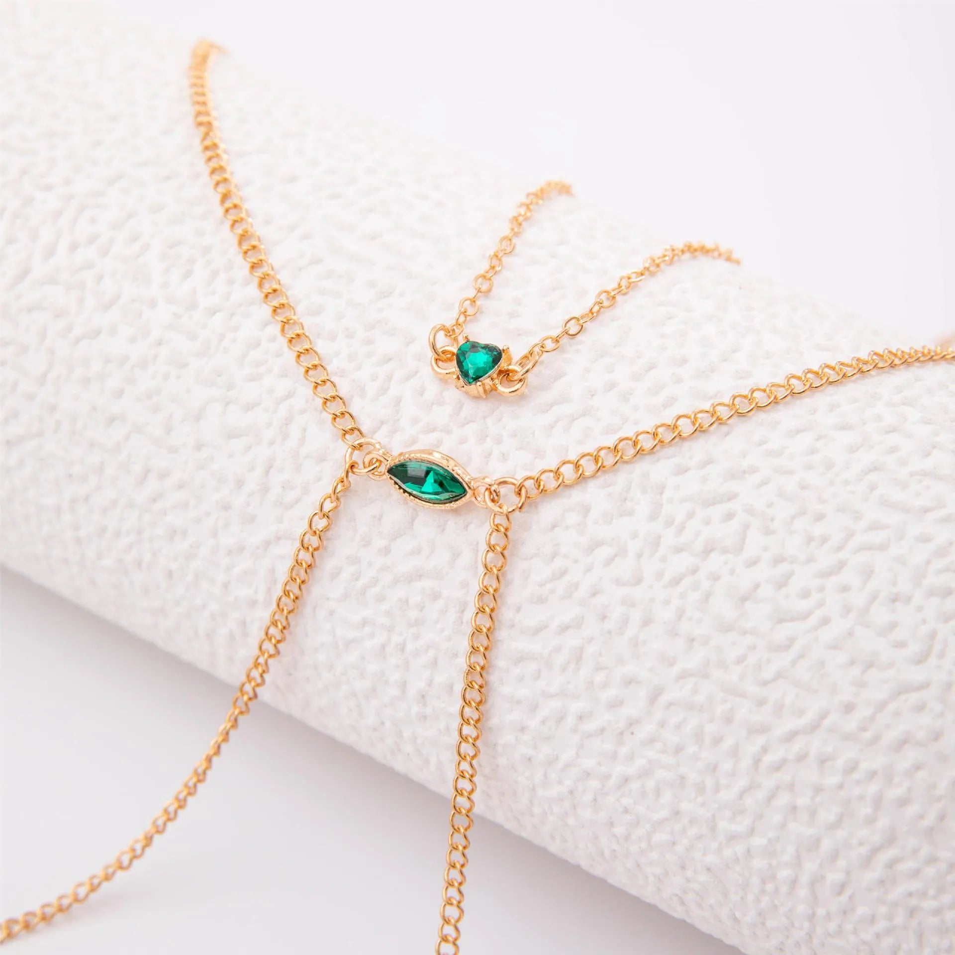 Men's simple gold-toned alloy body chain necklace with electroplated 25729 gold finish on a plain background.
