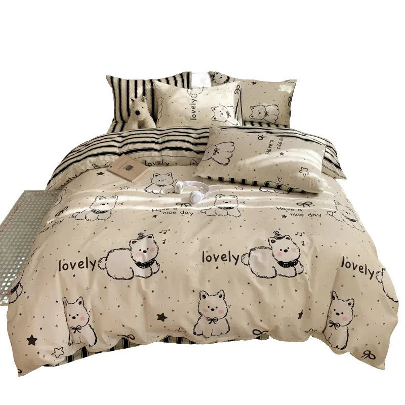 Cartoon dog pattern four-piece cotton quilt cover set laid on a bed.