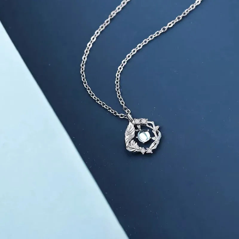 Women's geometric tree and bird pendant necklace with adjustable chain in blue eucalyptus colour