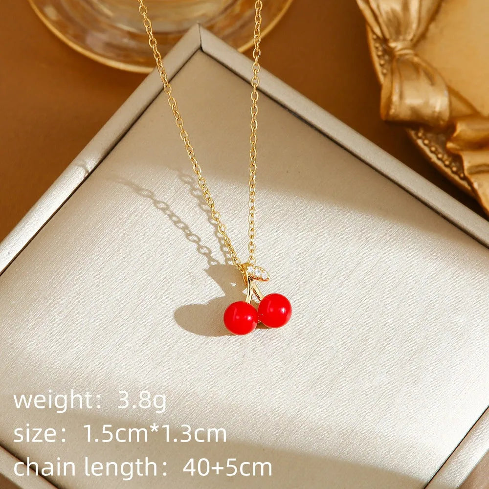 Titanium steel necklace with an indie-style cherry, strawberry, and pepper pendant on an O-ring chain.