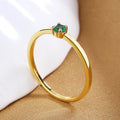 Geometric copper fine circle ring with single diamond detail showing white colour option