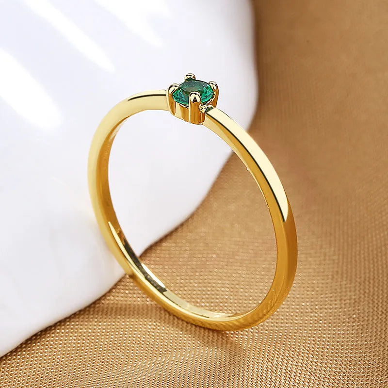 Geometric copper fine circle ring with single diamond detail showing white colour option