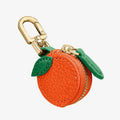 Mini PU leather coin bag keychain in cherry red colour, shown attached to a keyring.