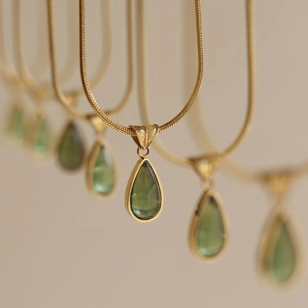 Retro titanium steel necklace with blue gemstone water drop pendant on a snake chain.