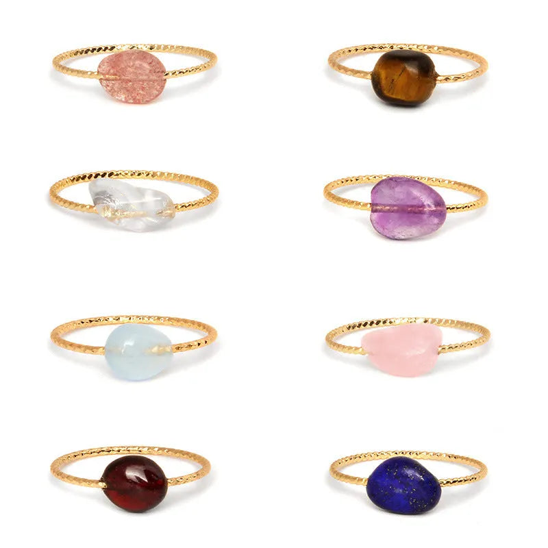 Close-up of a women's geometric agate ring showing its original design and coloured stone.