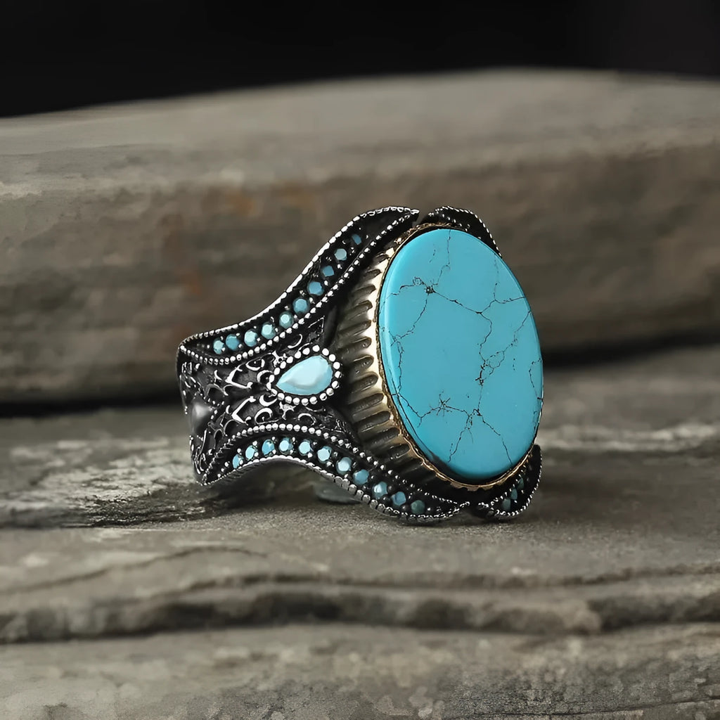 Men's turquoise alloy ring in antique silver colour showing round design and stone detail