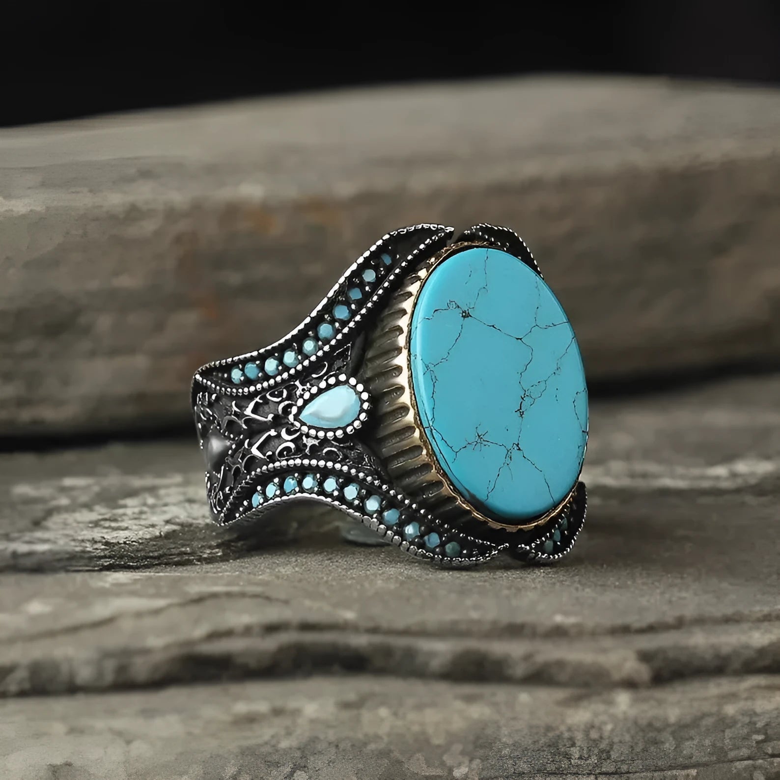 Men's turquoise alloy ring in antique silver colour showing round design and stone detail