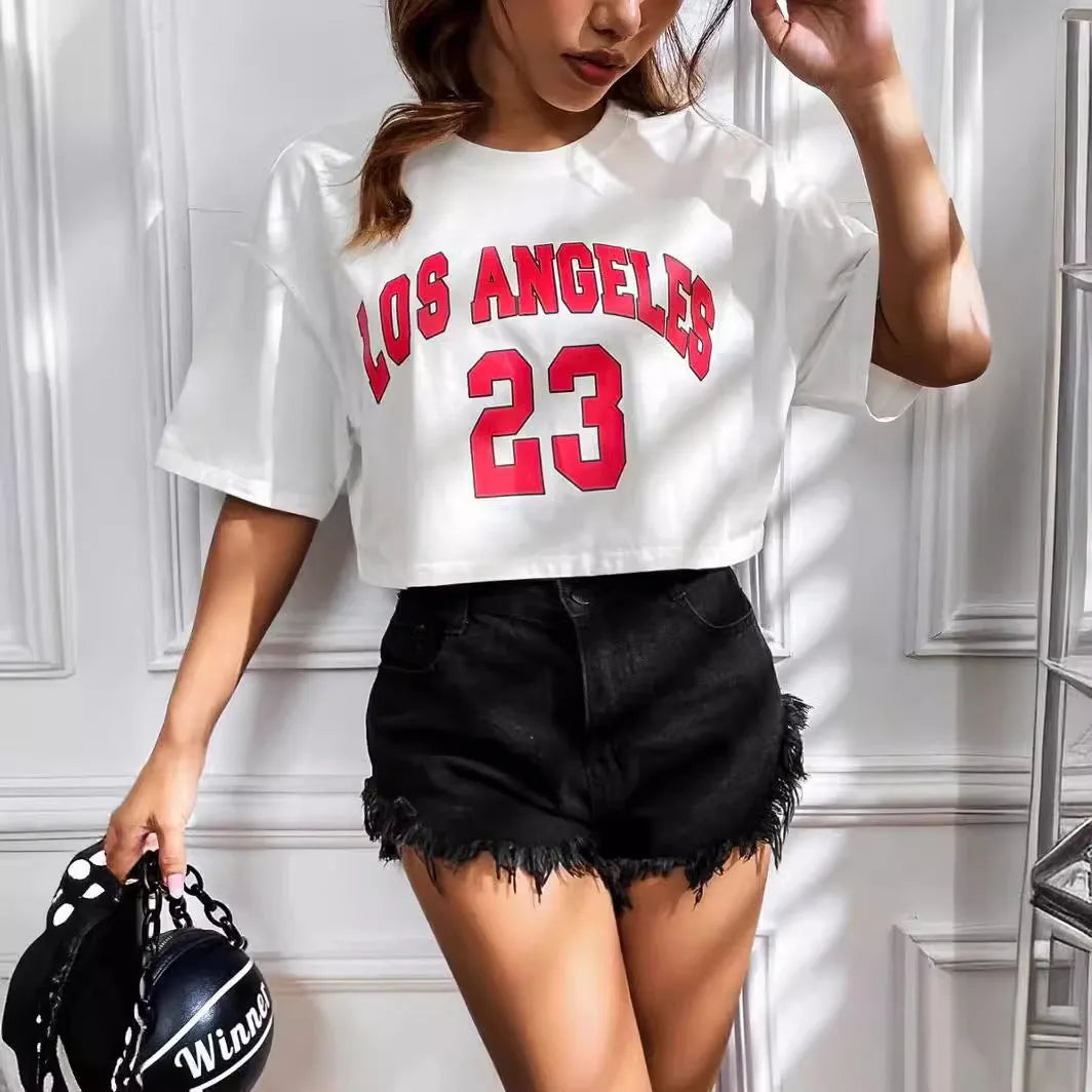 A black loose-fit cotton T-shirt with white printed English letters and a short navel-baring cut.