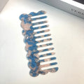 Geometric acetate hair comb with retro wave design in apricot colour