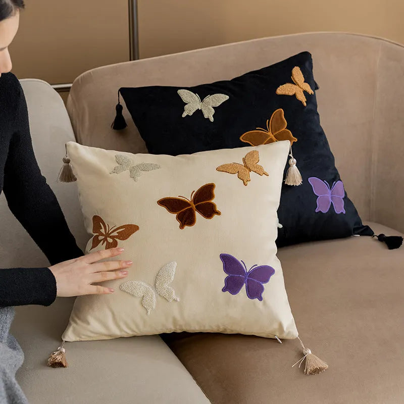 Square beige cushion with detailed Chinese style butterfly embroidery.