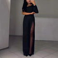 Women's black polyester jumpsuit with an oblique shoulder and a high slit on the leg.