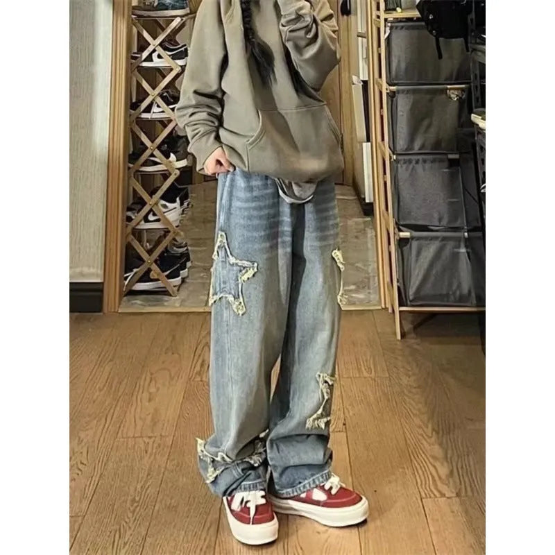 Blue high-waisted straight-leg women's jeans on a hanger.