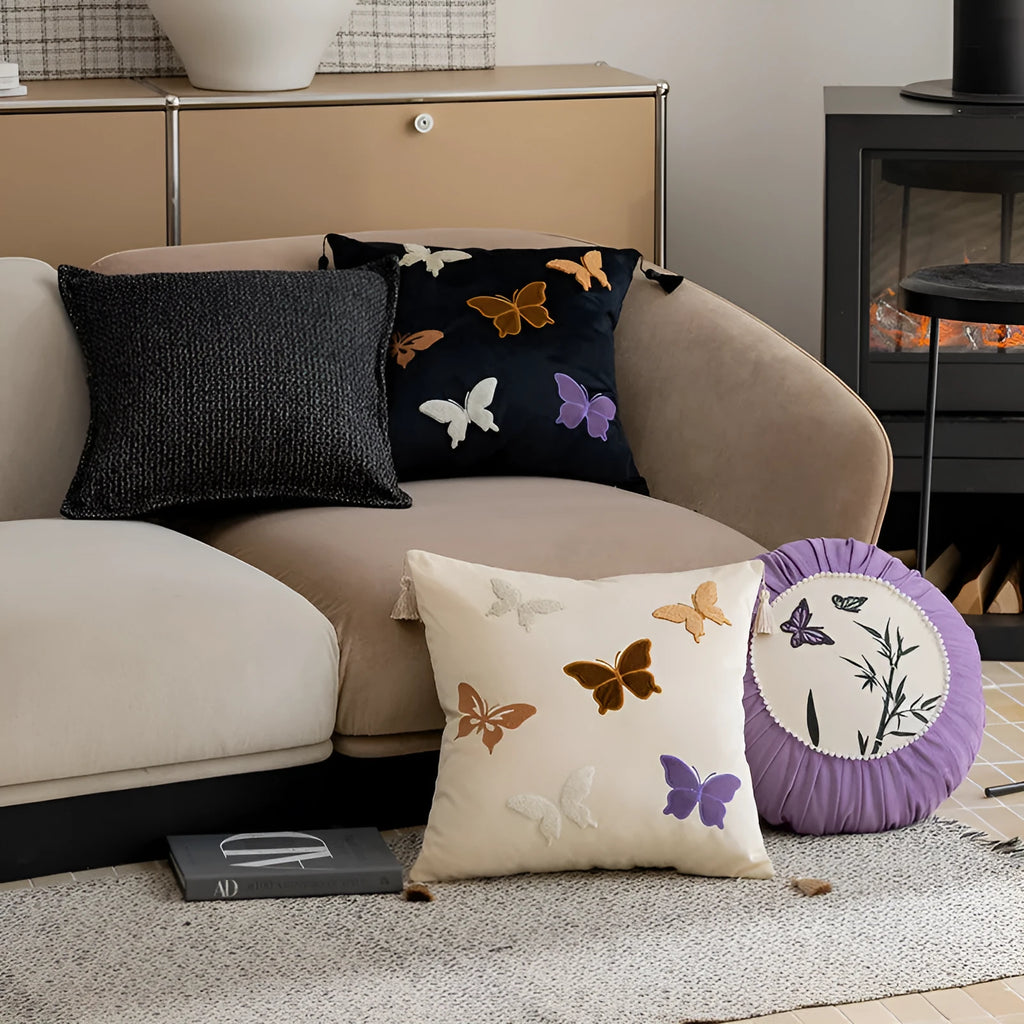Square beige cushion with detailed Chinese style butterfly embroidery.