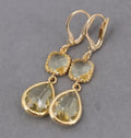 Gold geometric earrings with long crystal fringe and water droplet design
