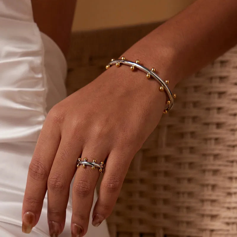 Stainless steel personality texture rivet bean beads bracelet with C-shaped design in gold finish