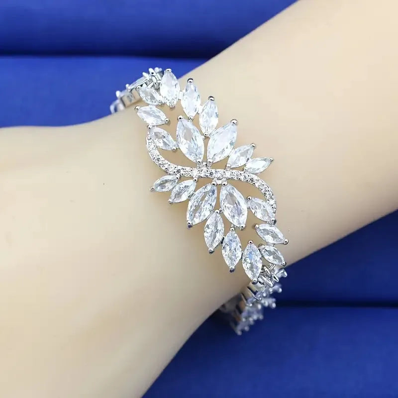 Gold electroplated copper fashion bracelet with zircon stones and ice flower design in multiple colours.