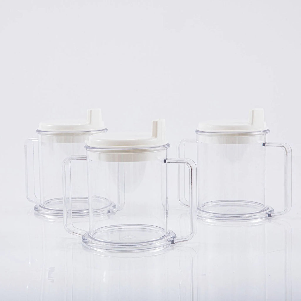 Transparent spill-proof drinking cup with straw lid showing modern minimalist design