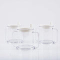 Transparent spill-proof drinking cup with straw lid showing modern minimalist design