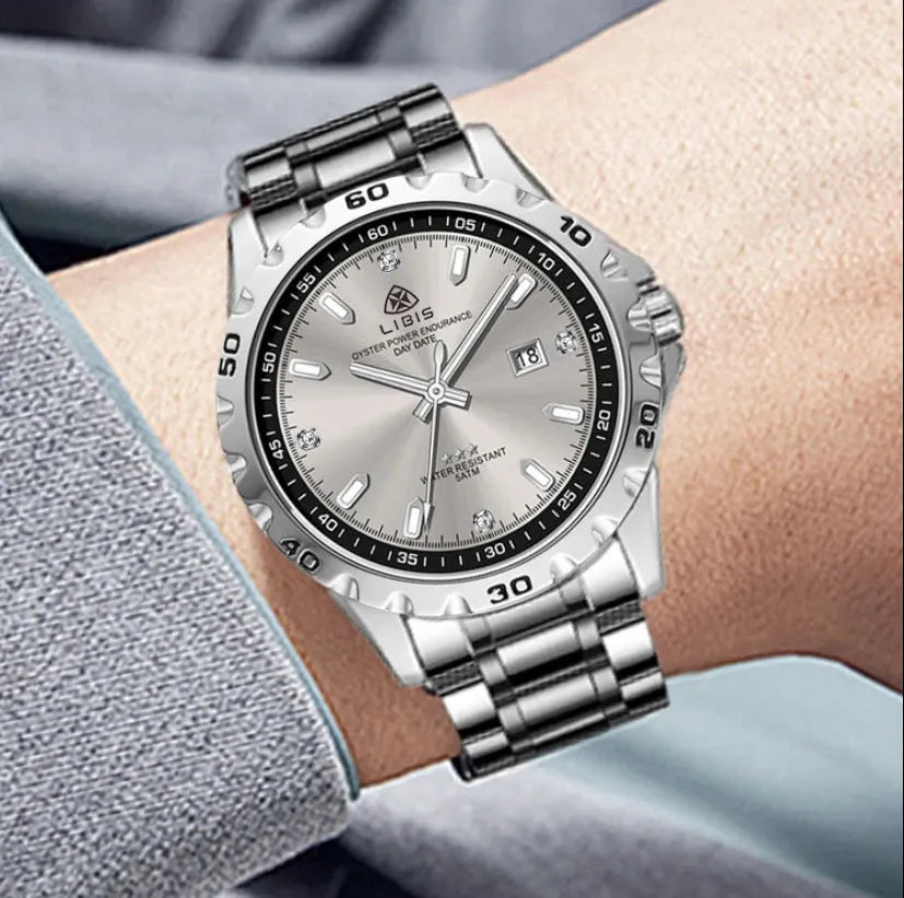 Men's silver case business watch with stainless steel strap and luminous hands on a grey dial.