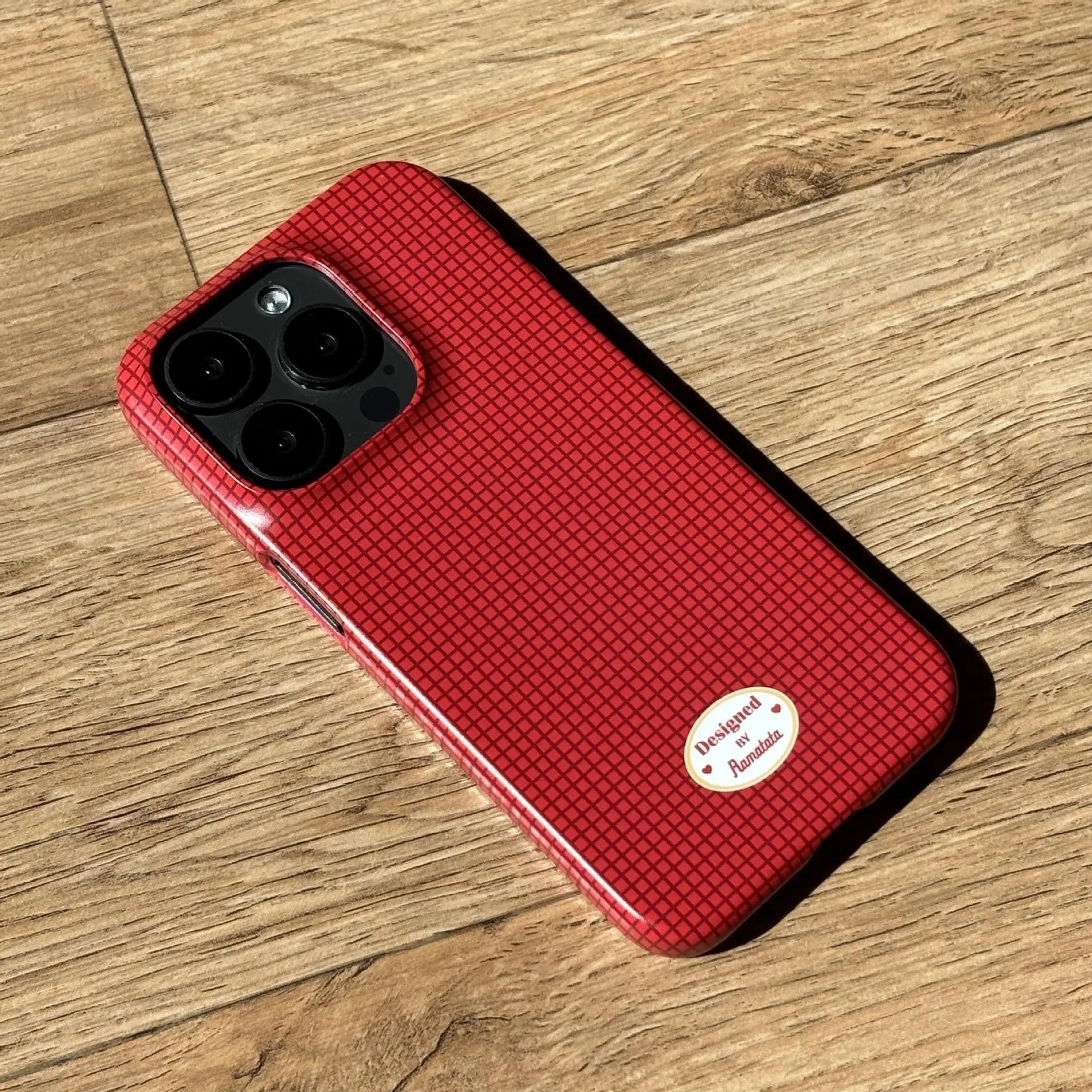 Original plaid design iPhone 15 Pro Max phone case in red and orange grid patterns with frosted and glossy finish options.