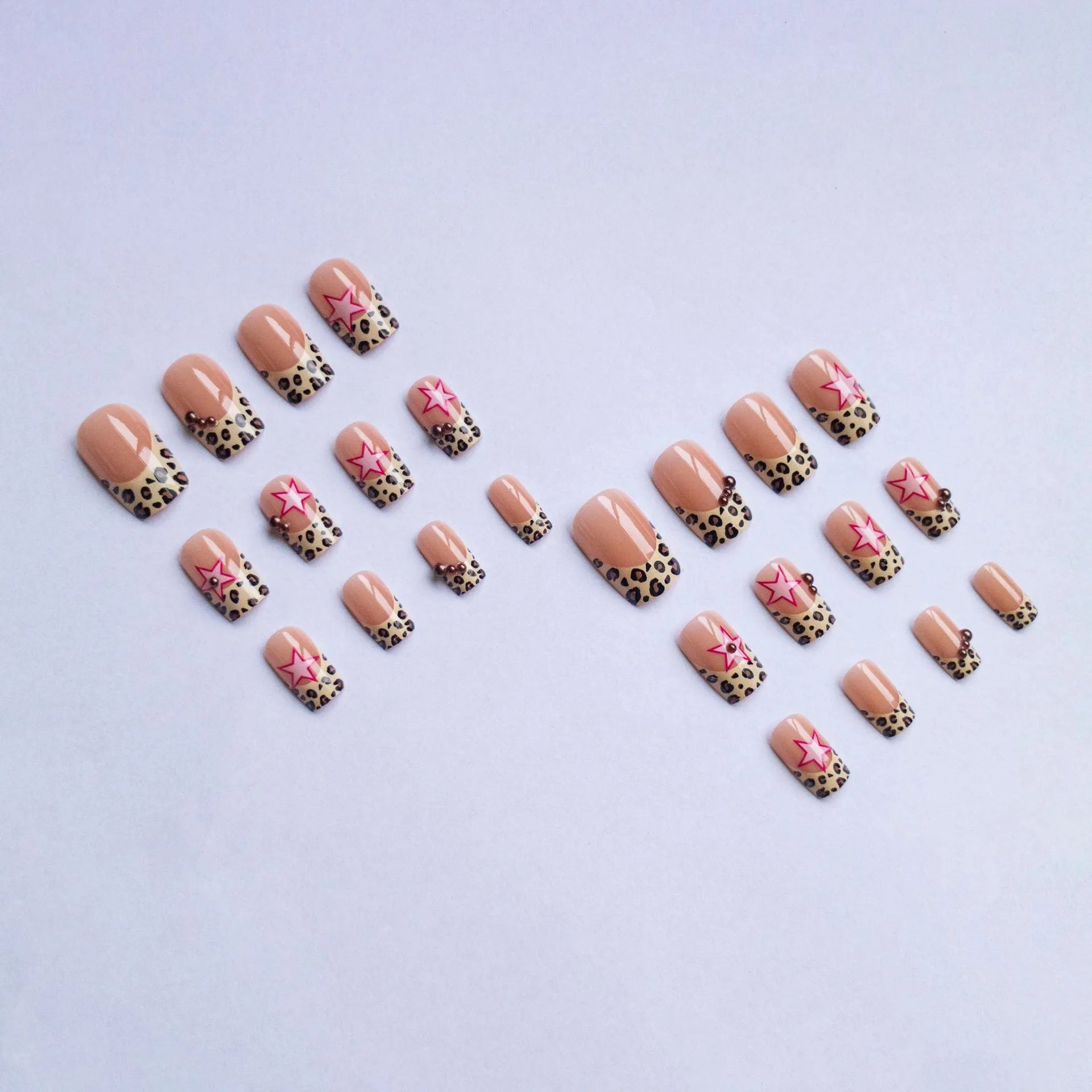 French manicure nail art set with leopard print patterns, five-pointed stars, pearls and diamond decorations