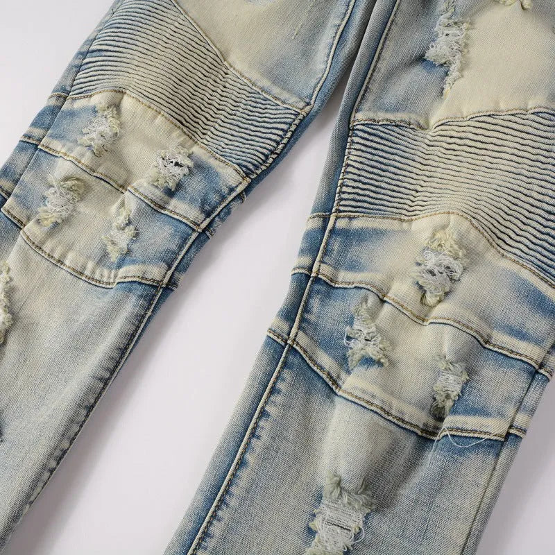 Light blue men's slim jeans with hand-frayed distressing and a distressed finish on the legs.