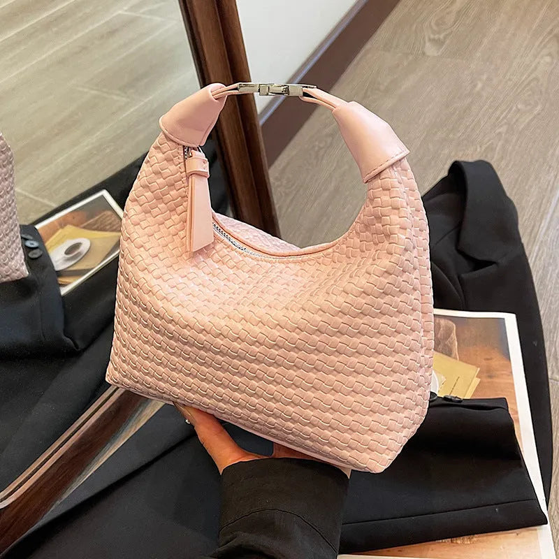 Soft PU leather bucket-style messenger bag in beige with a front sandwich pocket and shoulder strap.