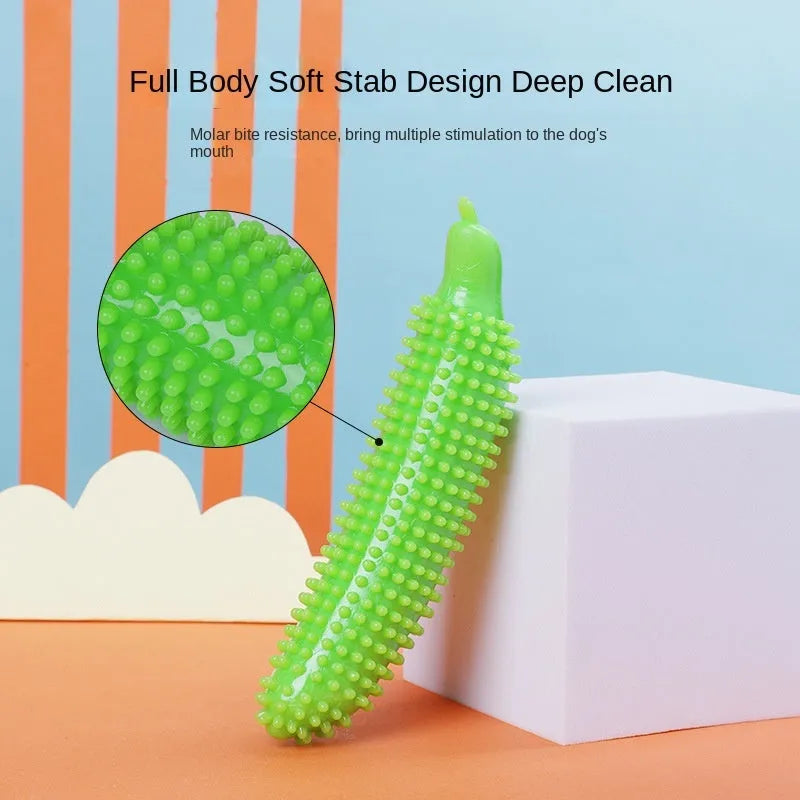 Green cucumber-shaped dog chew toy for teething and interactive play, approximately 20 cm long