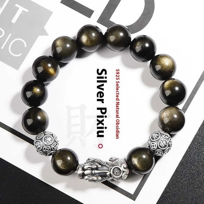 Men's geometric bracelet with a polished obsidian bead and 999 sterling silver on a leather strap.