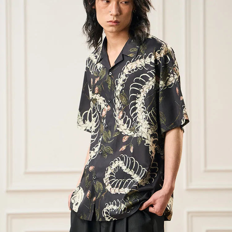 Original snake bone theme floral print on a loose, short sleeve Cuban collar shirt in assorted colours.
